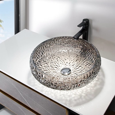 El fregadero decorativo cromado del cuarto de baño rueda forma de la bola alrededor del fregadero de cristal de plata del buque