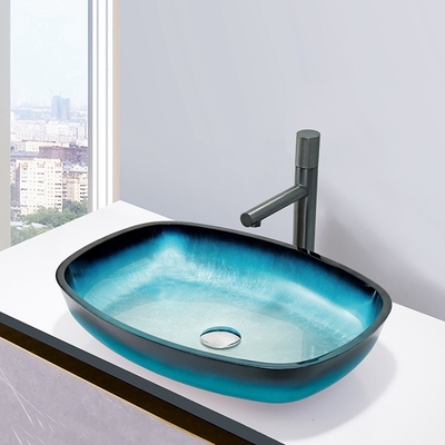 La encimera moderada azul de la sobremesa de la forma del melón de los lavabos del baño de la pendiente de cristal montó